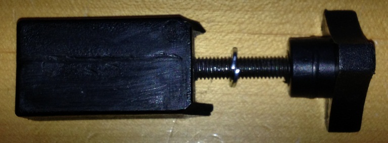 The Louisville Slugger Ultimate pitching machine replacement part known as  the Nylon Support Block with Knob.